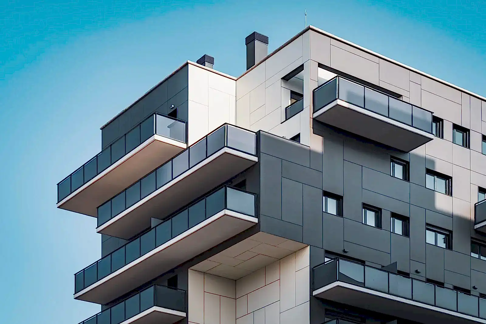 Geometric facades of a residential building full of balconies and windows